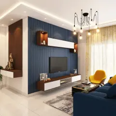 Nowoczesne aranżacje małego salonu: niebieska ściana z TV, złota musztardowa sofa, żółty fotel i drewniane akcenty.