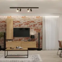 Nowoczesna aranżacja salonu w stylu loft z ceglaną ścianą, drewnianymi meblami i czarnymi dodatkami.